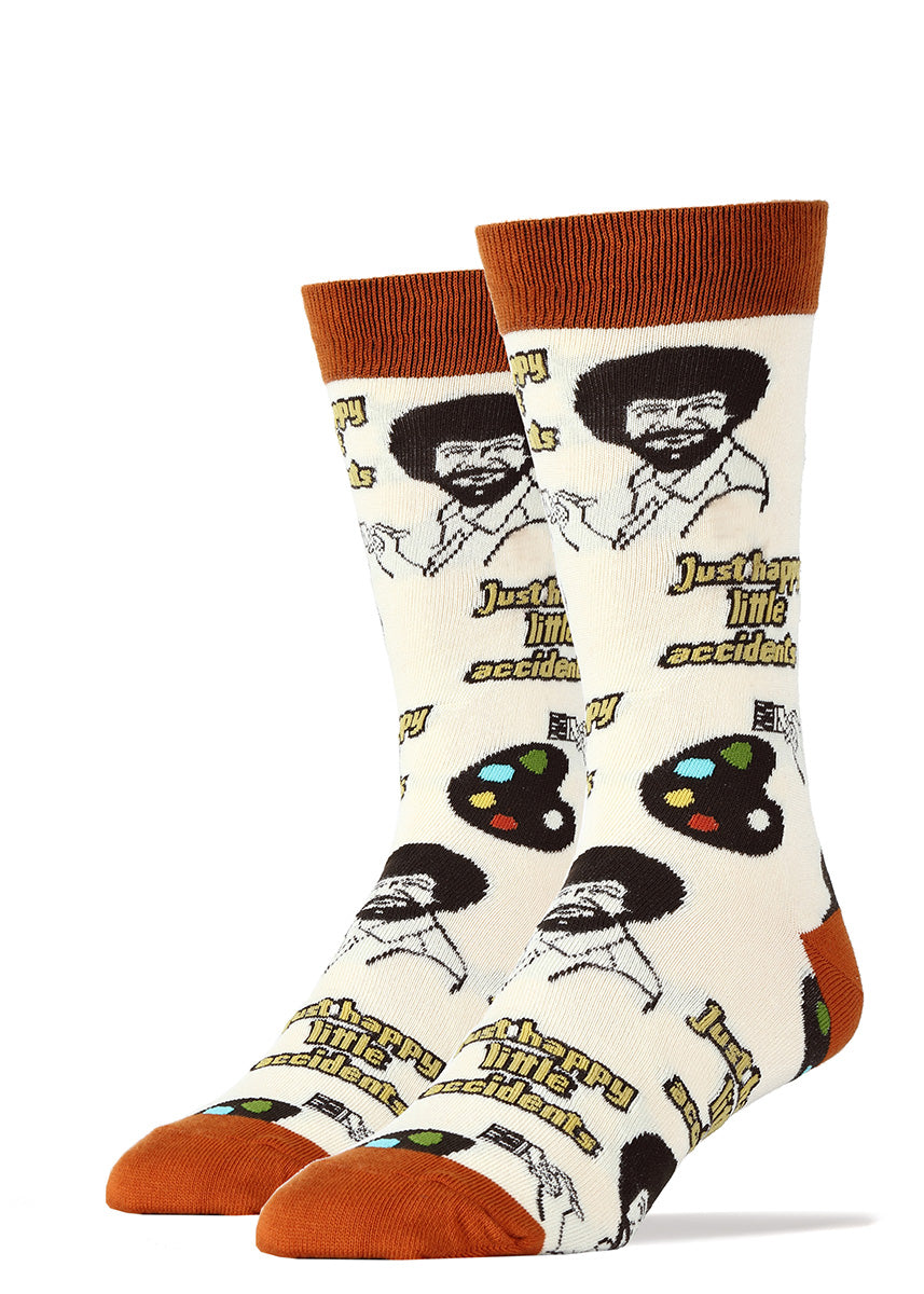 Bob Ross socks for men with painter's palettes and the words "just happy little accidents."