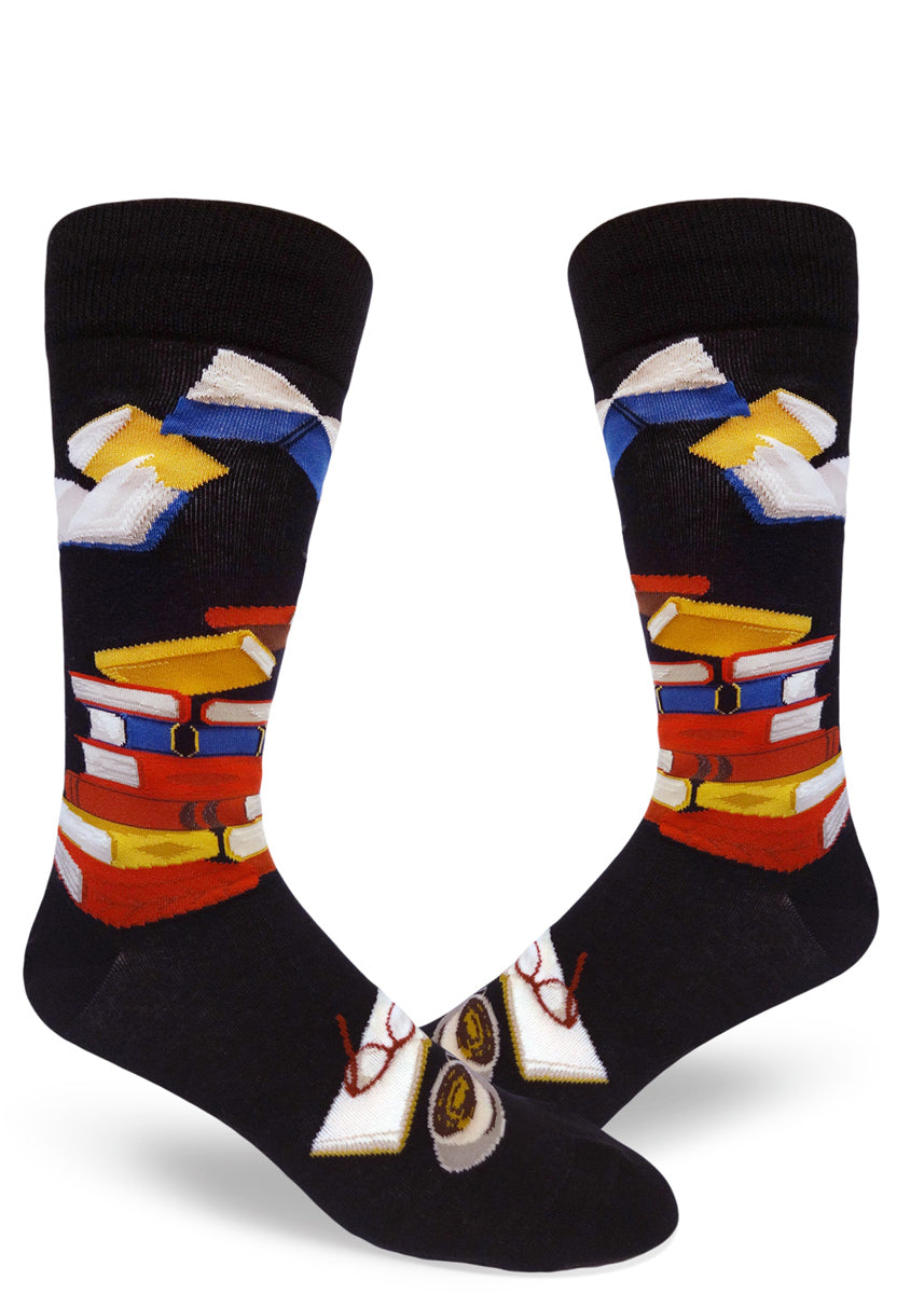 Book socks for men with books in different colors stacked up, a book being read and books flying through the air
