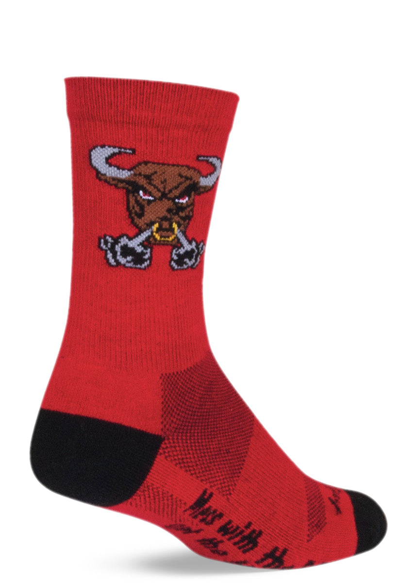 Red socks with an angry bull and the words “Mess with the bull, get the horns” on the sole of the foot.