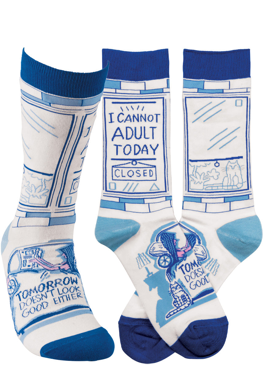 Funny crew socks show a person relaxing and a window that says, "Closed: I cannot adult today," with "Tomorrow doesn't look good either" further down on the foot.