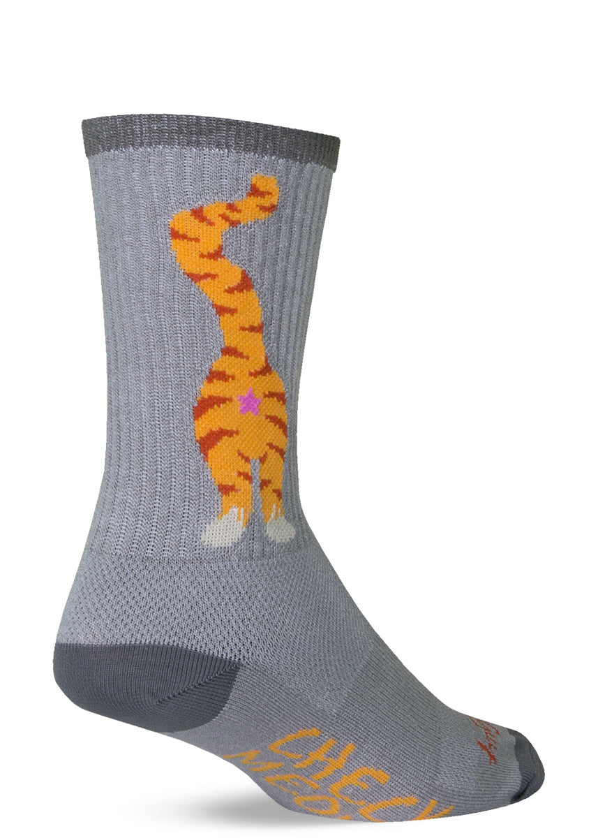 Cat butt socks with cat anuses and the words "CHECK MEOWT" on the bottoms of the feet