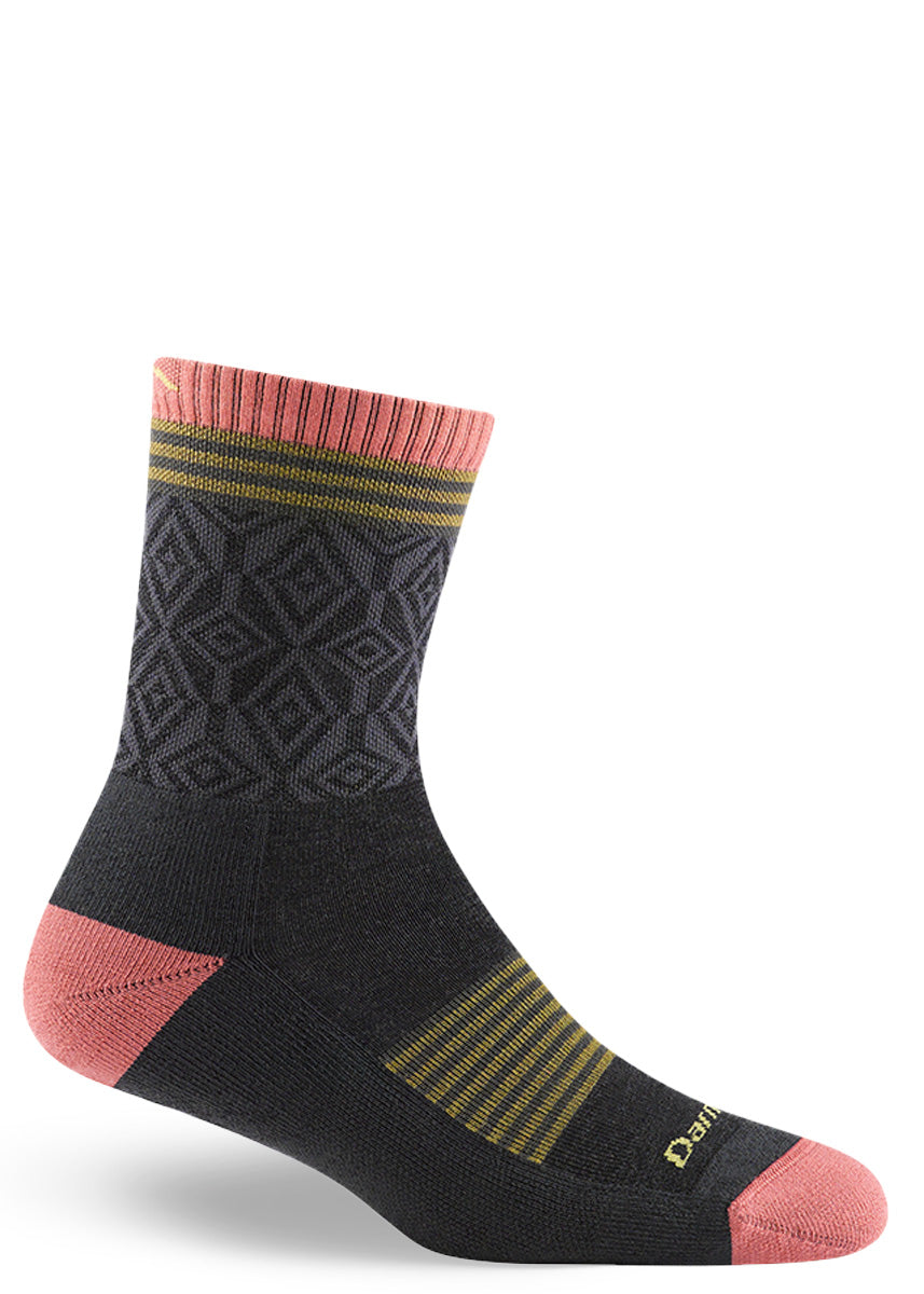 Wool hiking socks for women feature subtle geometric patterns in light gray and dark gray with striped yellow accents and coral pink cuff, toes, and heel.