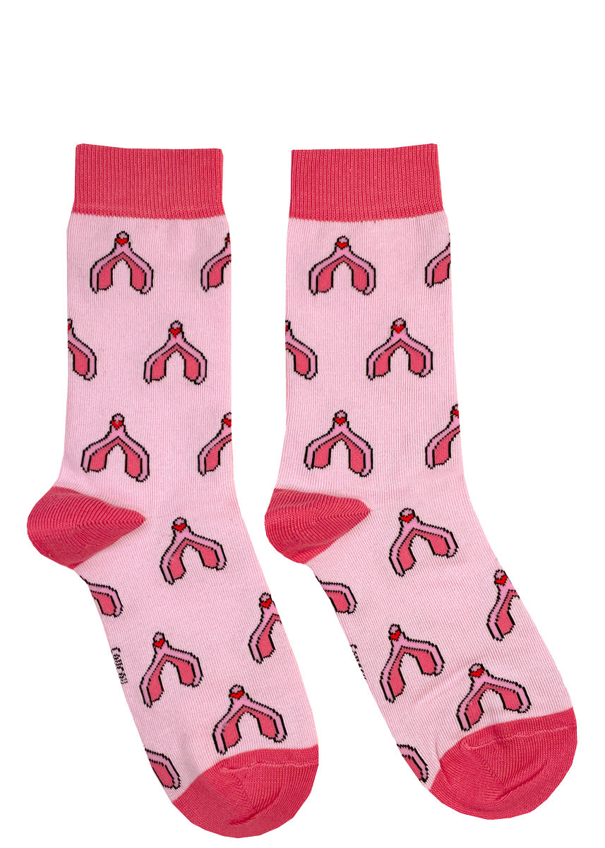 Cute pink socks feature cartoon clitorises with little red hearts.