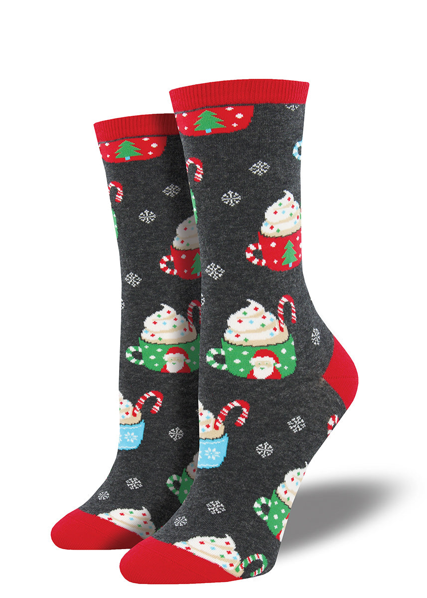 Christmas mugs of hot cocoa with whipped cream decorate these cute wintry women&#39;s socks.