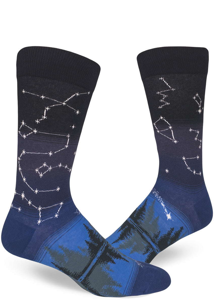 Men's constellation socks with stars mapped on the leg and evergreen trees on the foot.