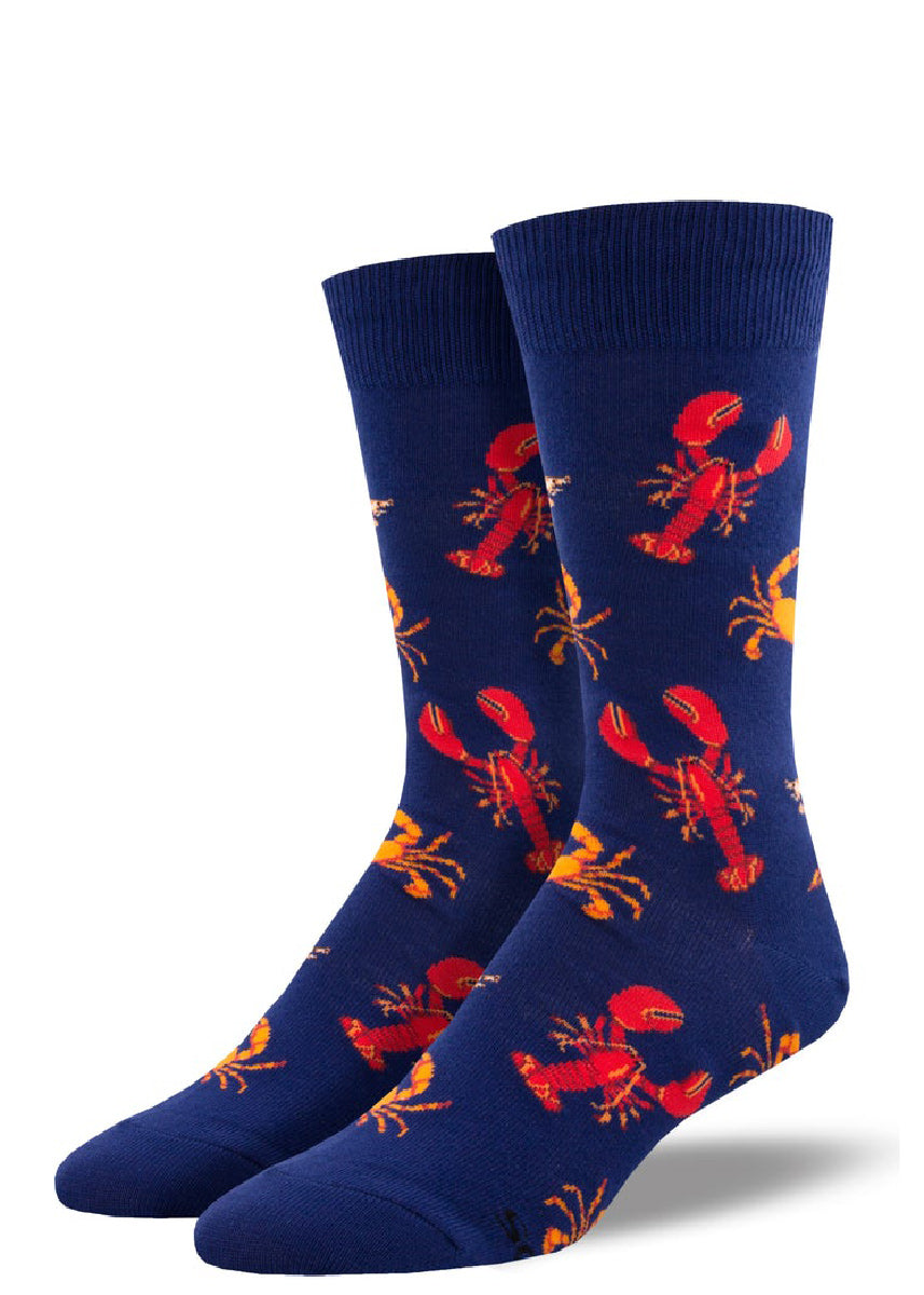 Crustacean socks for men feature a pattern of crabs and lobsters over a navy background.