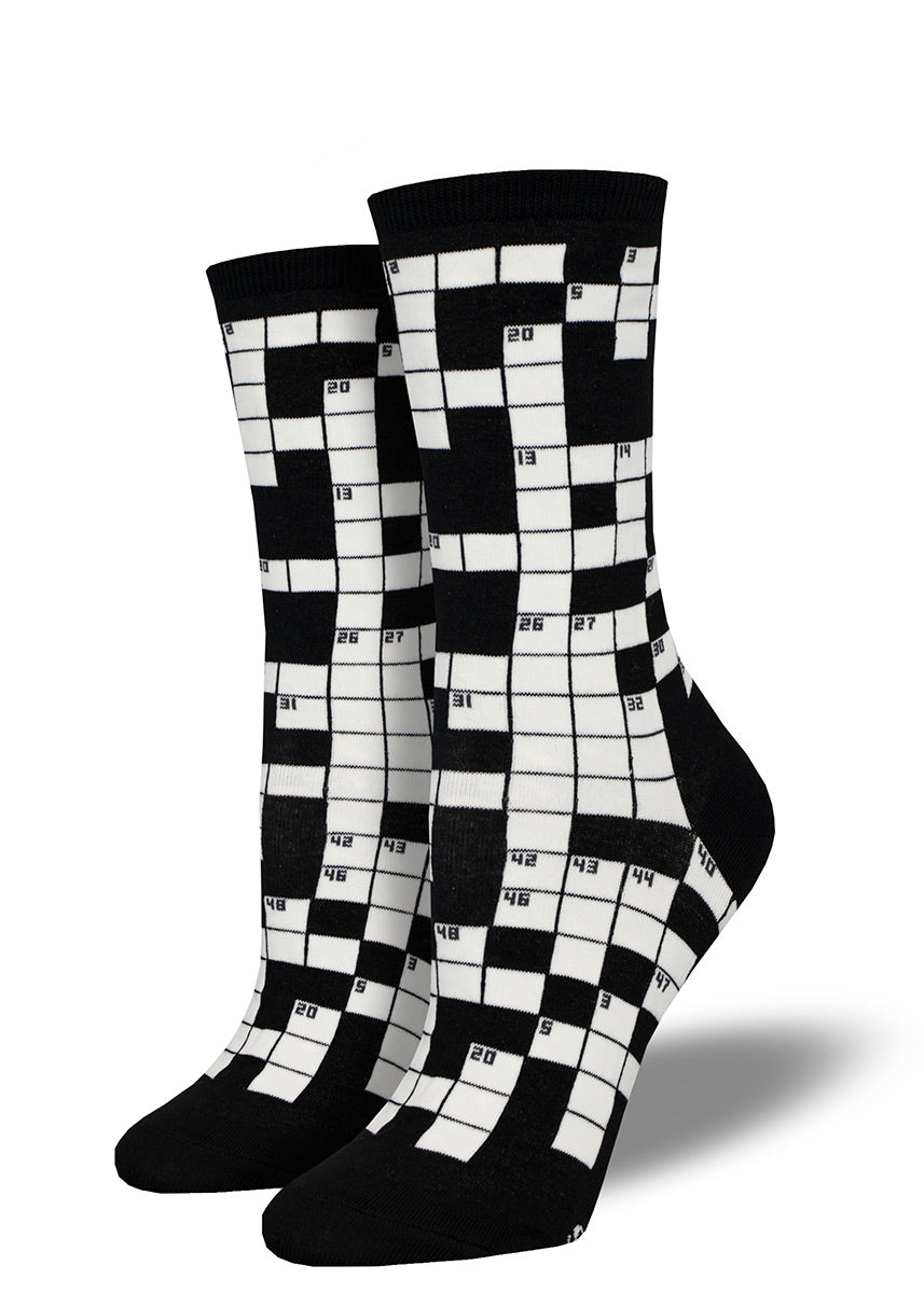 Novelty crew socks covered in black and white squares to resemble a crossword puzzle.