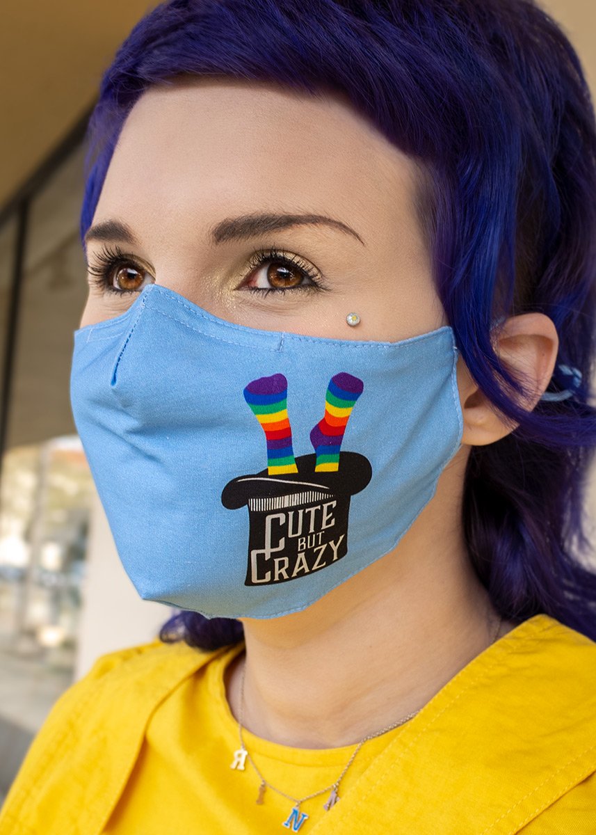 Face mask for adults features an upside down top hat with the words "Cute but Crazy" and rainbow socks coming out the top!