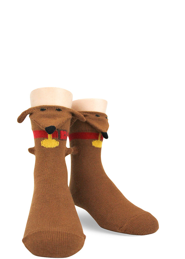 Funny 3d dachshund dog socks for kids with a dimensional wiener dog looking out over the top.