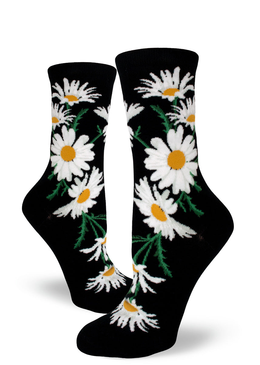 Daisy flower socks for women with white and yellow daisies on a black background