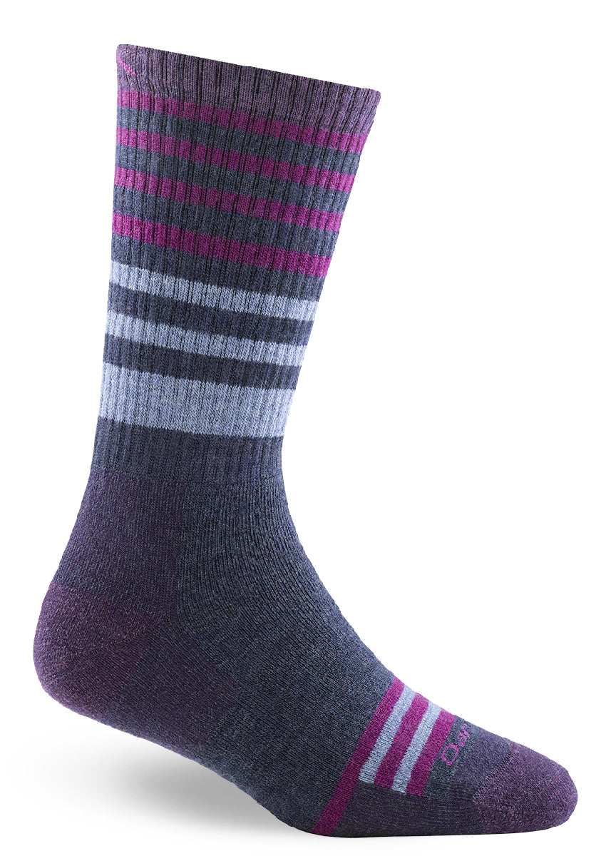 Cushioned wool boot socks for women with magenta stripes on a purple background. 