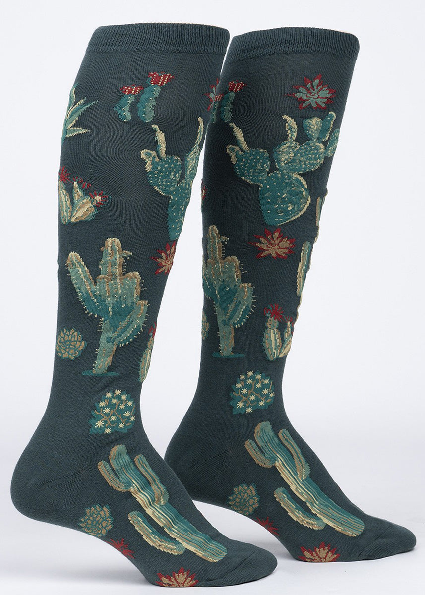 Desert cactus knee high socks feature a variety of glorious cacti on a dark teal background: prickly pears, saguaros, agave, and more!