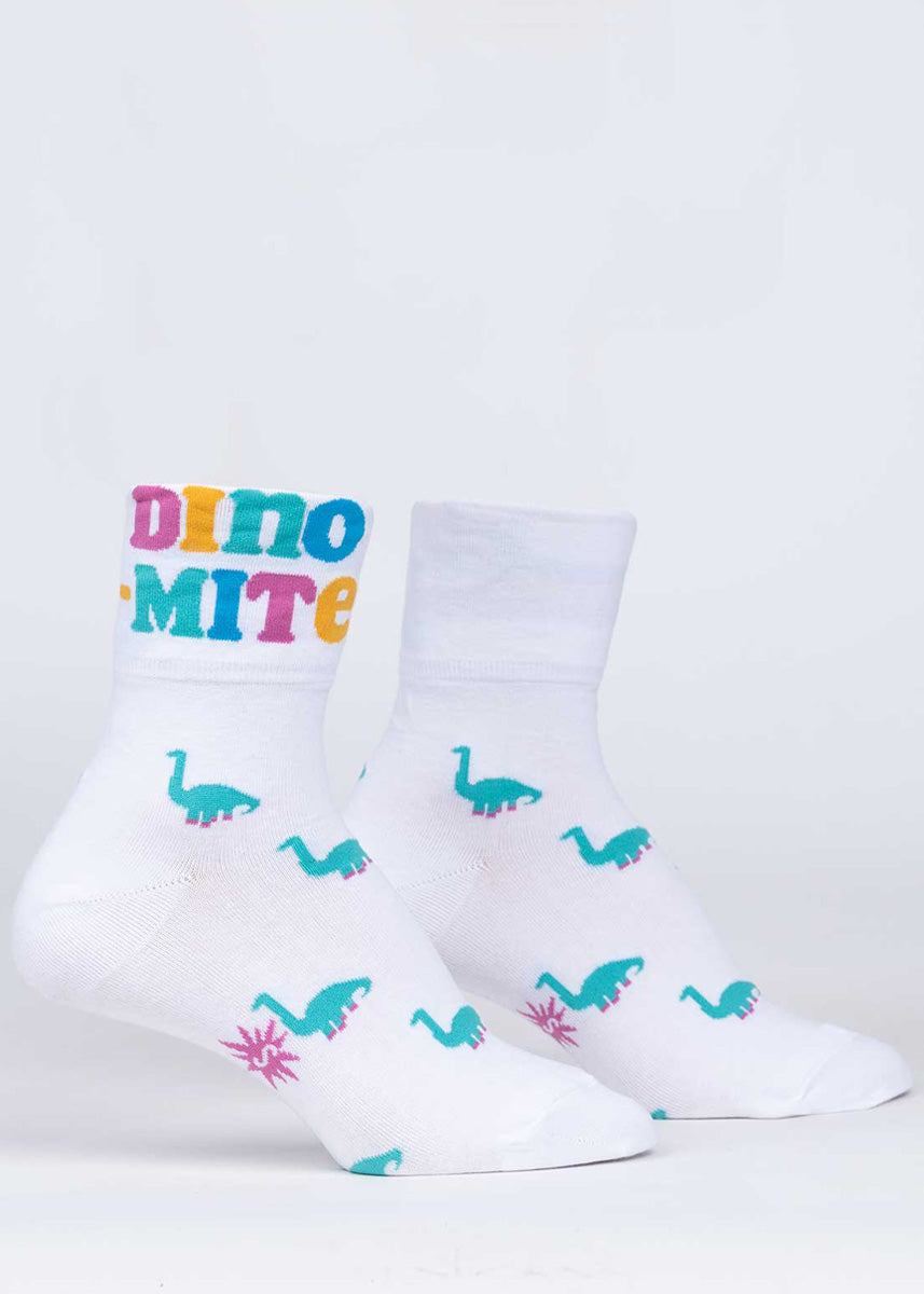 Dinosaur socks for women feature turquoise dinosaurs and the word &quot;Dino-mite&quot; when the cuff is rolled up.