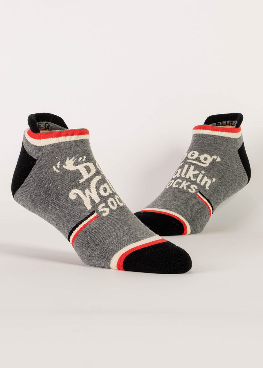 Heather gray ankle socks that say “Dog Walkin&#39; Socks” with red, black and white stripes.