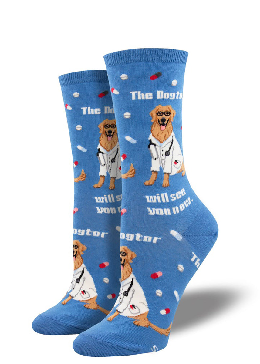 Veterinarian dog socks with golden retrievers wearing glasses and lab coats, along with the saying “The Dogtor Will See You Now.&quot;
