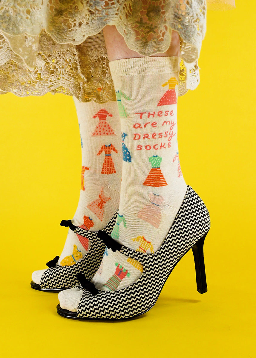 Cute dress socks for women show colorful dresses on a taupe background with the words, &quot;These are my dressy socks.&quot;