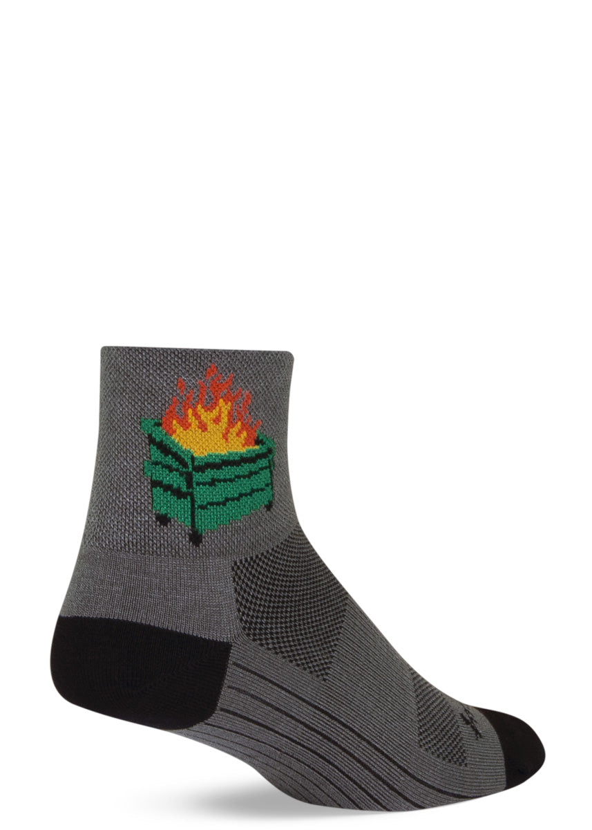 Funny athletic socks feature a just-above-ankle length and a design of a dumpster fire on a light gray background 