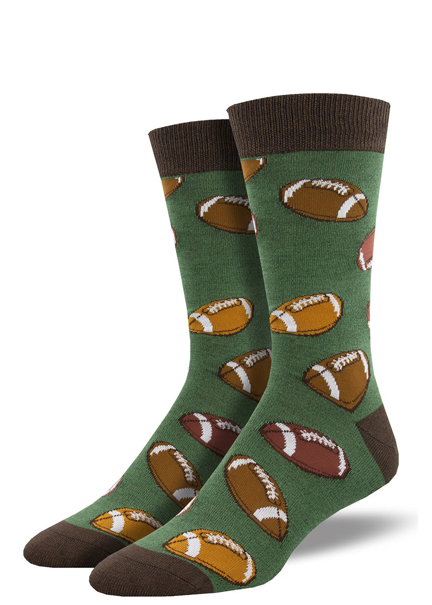 Bamboo crew socks for men feature a design of brown footballs on a green background.