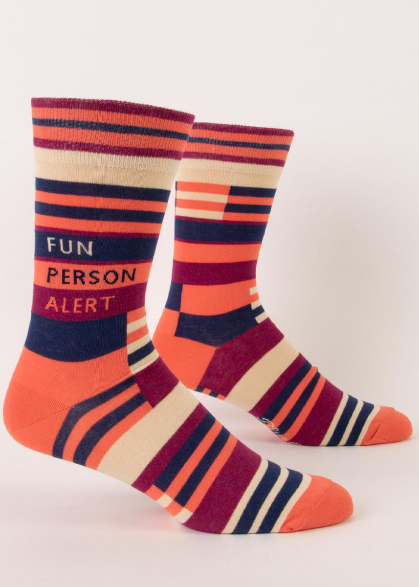 Funny socks for men feature a striped design in coral, navy, magenta, and taupe with the words, "Fun Person Alert."