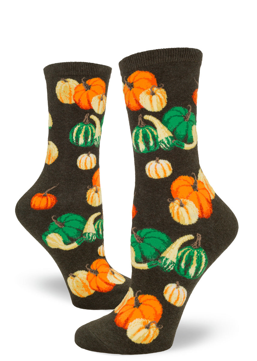 Adorable crew socks for women feature pumpkins and other gourds in shades of orange, yellow, and green; a vibrant Autumn harvest!