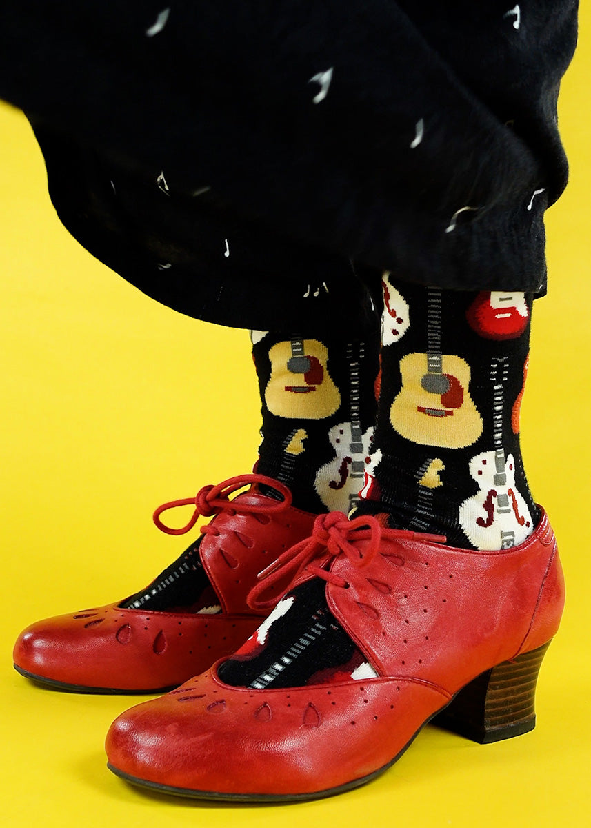 Guitar crew socks for women feature electric and acoustic guitars and look great with red heels!