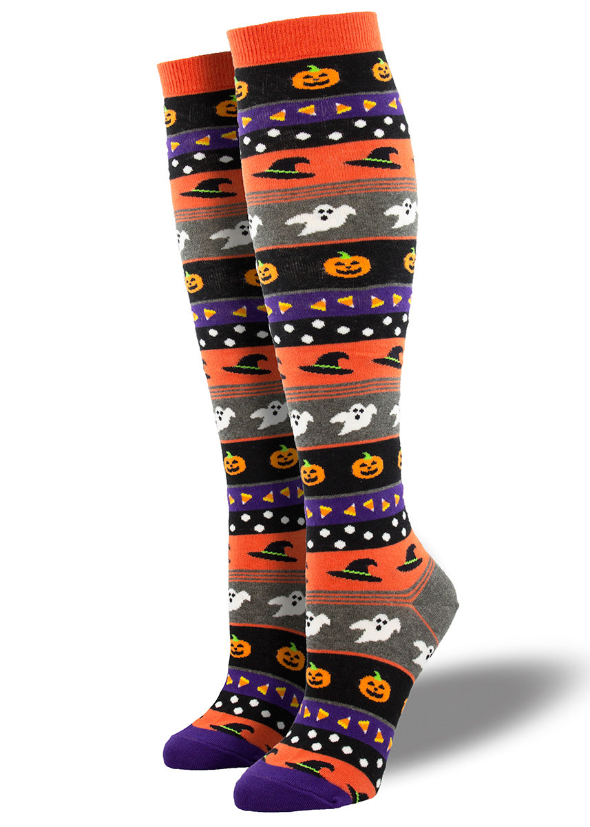 Cute Halloween-themed knee socks feature stripes with ghosts, witch hats, jack-o&#39;-lanterns, and candy corn!