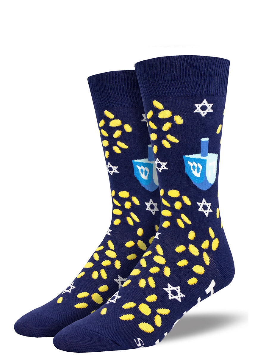 Novelty crew socks for men in navy with golden gelt and stars of David, plus cute blue dreidels and the words “HOW I ROLL” on the bottoms of the feet.