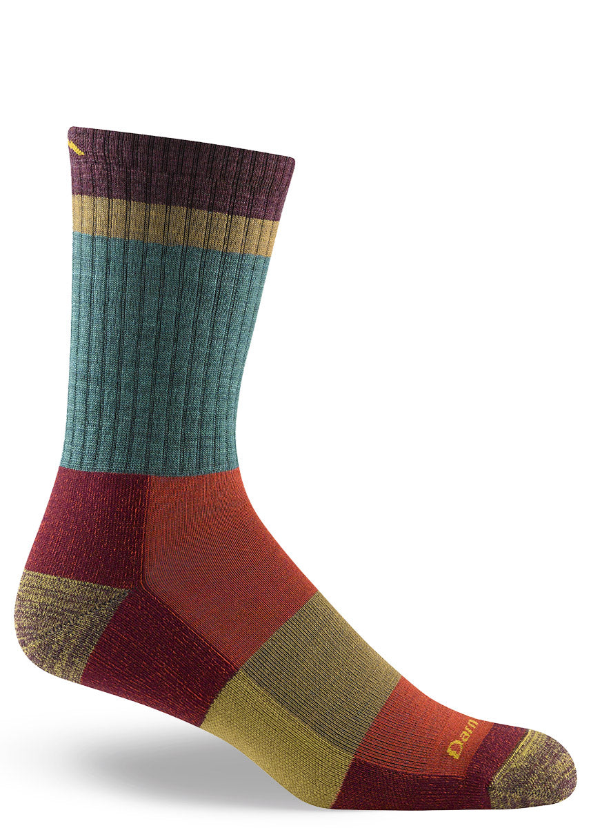 Men&#39;s wool hiking socks with teal, orange, red, chartreuse and maroon colorblocked sections.
