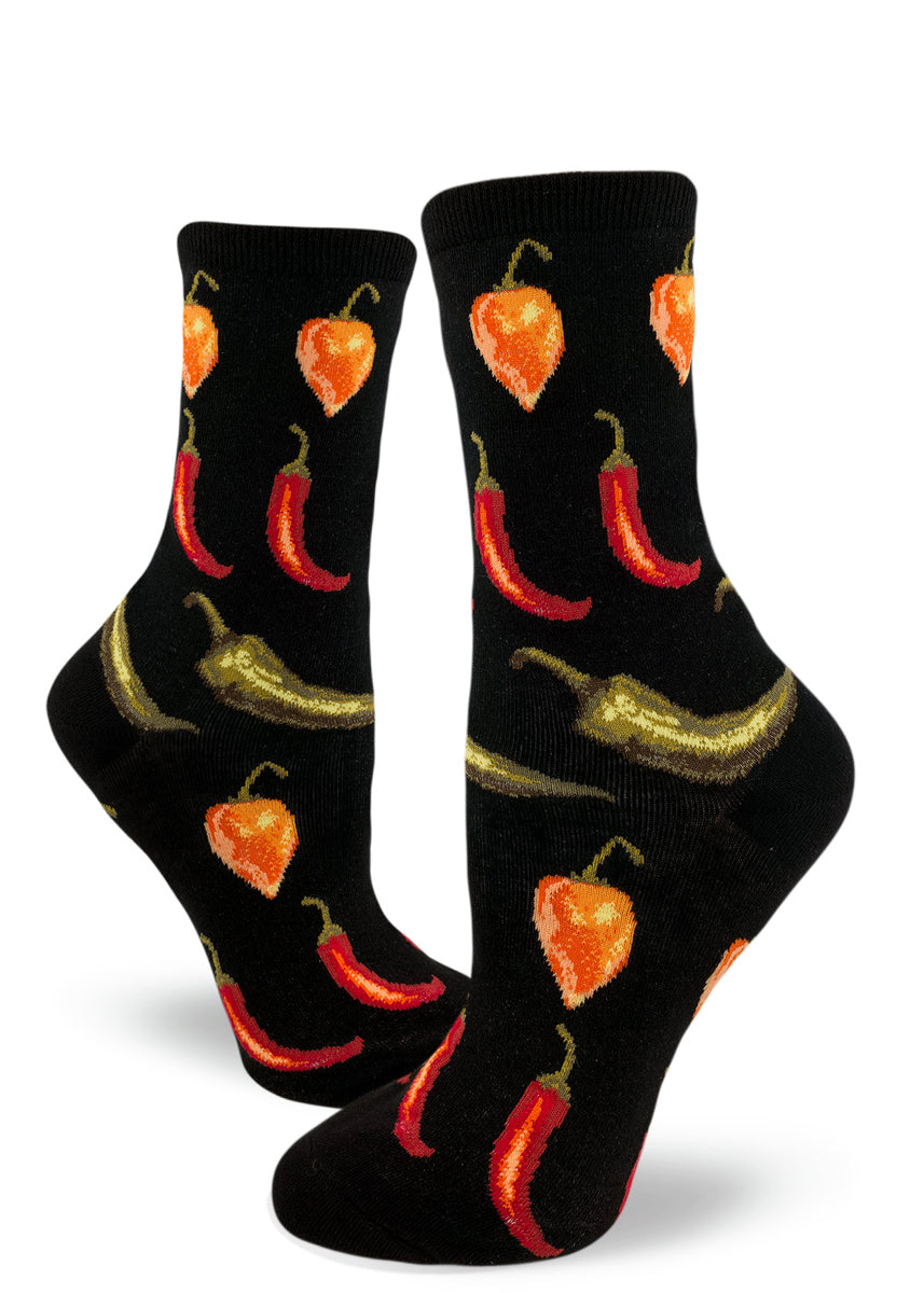 Women's chili pepper socks with orange habaneros, red cayenne peppers and green jalapeños on a black background