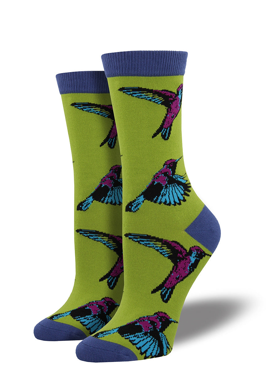 Hummingbirds fly on these green bamboo socks for women.