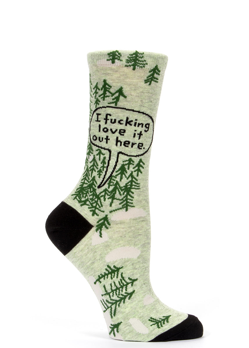 Women's socks with trees and a speech bubble that says "I fucking love it out here."