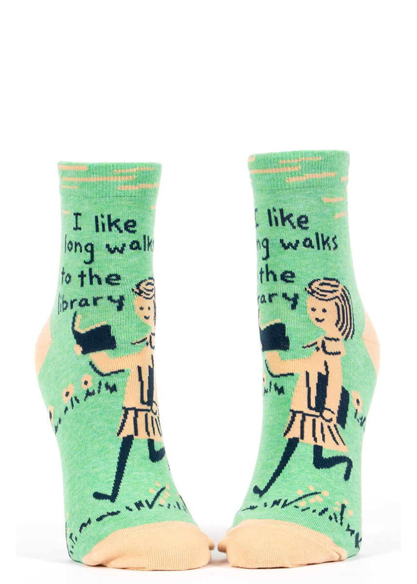 Ankle socks for women show a girl reading with the words, "I like long walks to the library."