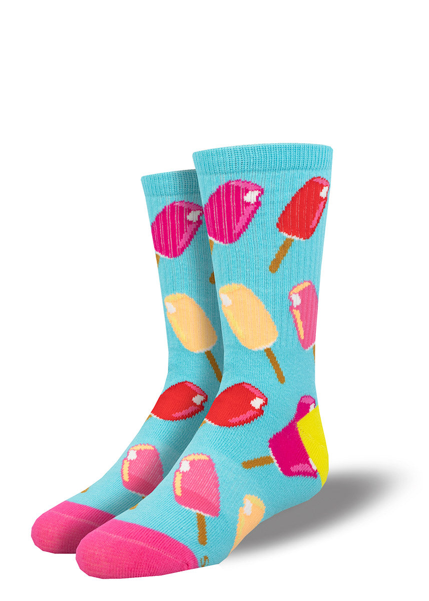 Blue athletic crew socks for kids feature an allover pattern of ice cream bars in red, pink and yellow.