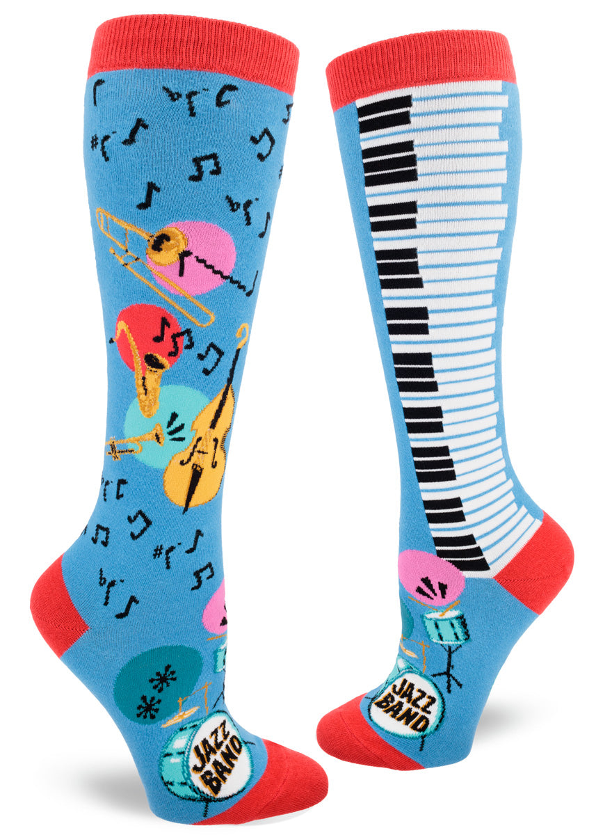 Blue knee socks with red accents feature a colorful jazz band design that includes saxophones, trumpets, trombones, standup bass, piano keys and drum sets, plus lots of music notes.
