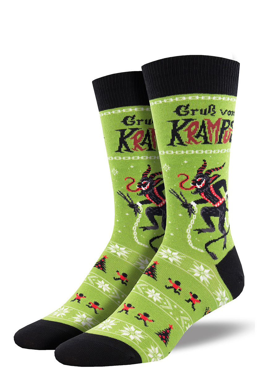 Christmas socks for men show Krampus, the Christmas goat demon, with horns, a long curled tongue, and a trident, ready to chase after naughty children.