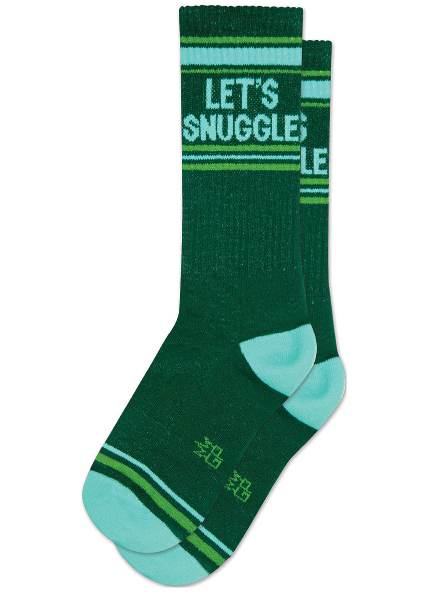 Dark green retro gym socks with aqua and green stripes and the phrase “LET&#39;S SNUGGLE&quot; on the leg.