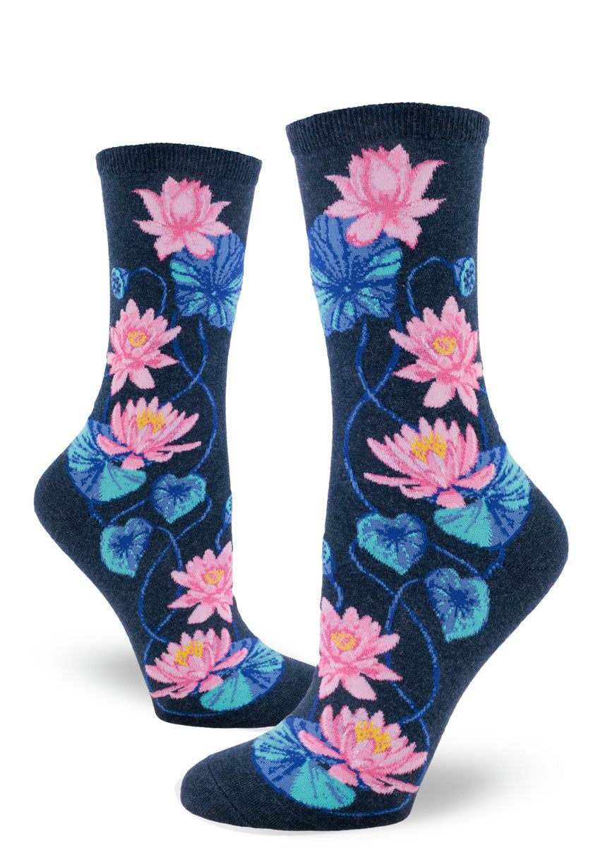 Lotus crew socks feature pink flowers with blue foliage and seed pods against a heather navy background.