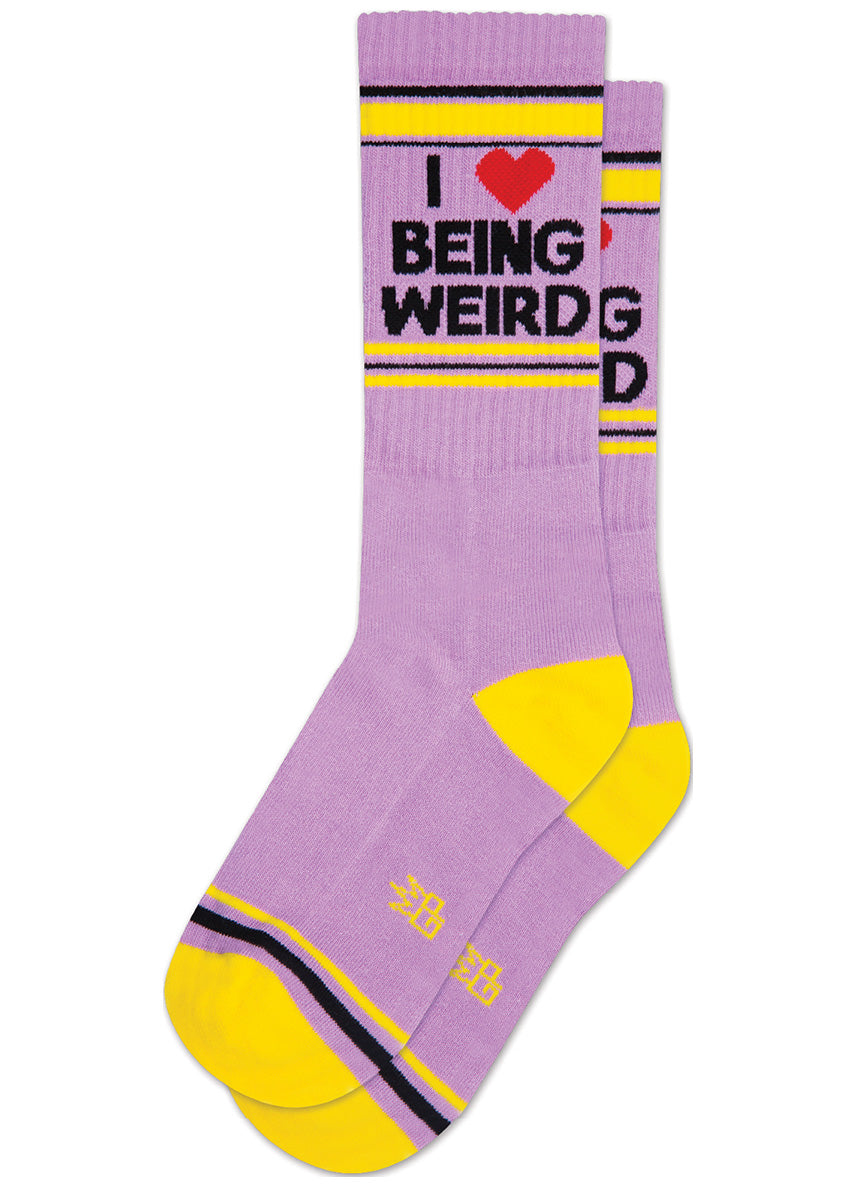 Funny purple retro gym socks with the phrase “I ❤️ Being Weird" on the leg.