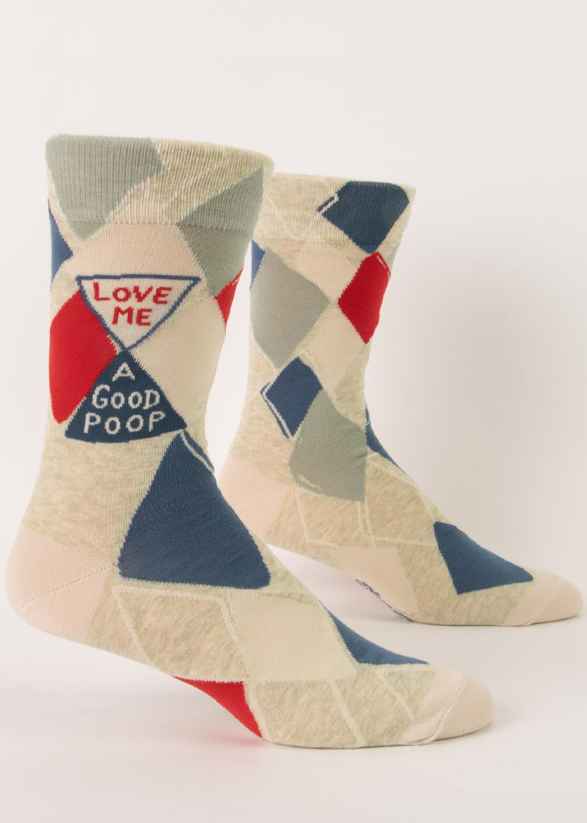 Funny crew socks for men feature an abstracted argyle pattern with the words, "Love me a good poop."