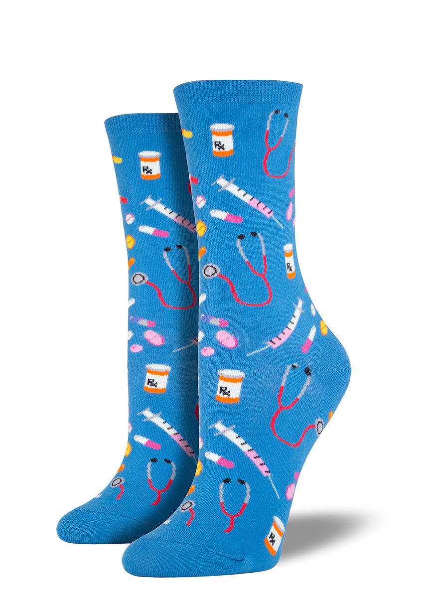 Medical socks for women with pills, stethoscopes and syringes on black socks