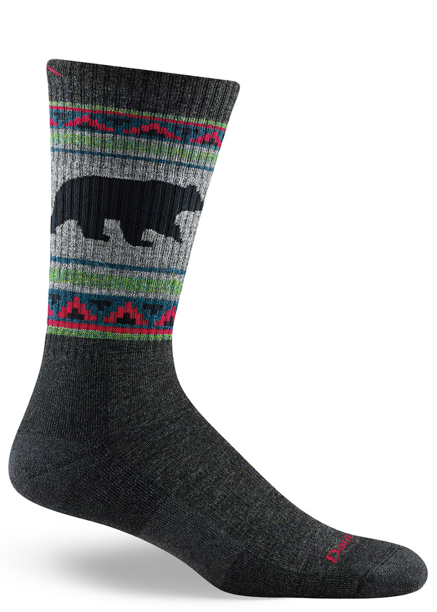 Cushioned wool socks for men come in a long boot-length and feature a silhouette of a bear.