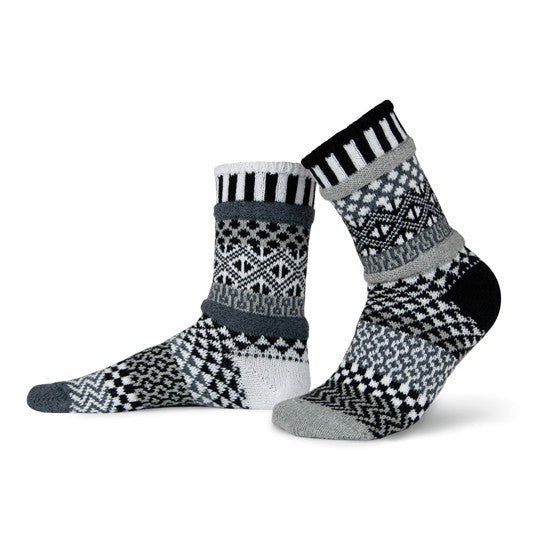 These special mismatched socks are knit with shades of gray, black and white.