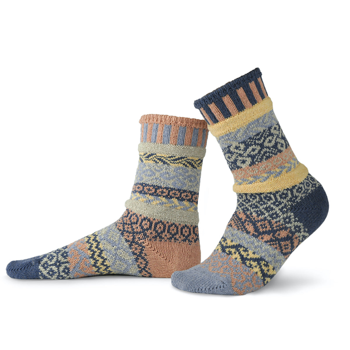 Cozy mismatched pattern socks in peach, pale yellow, dark blue, and light blue.
