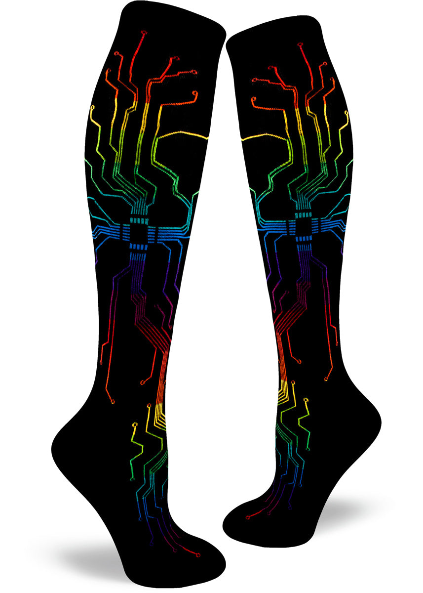 Knee-high circuitboard socks for women with rainbow circuits on a black background