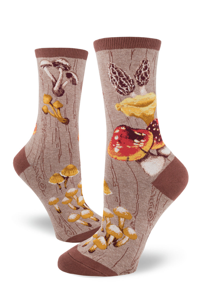 Mushroom socks for women with different mushrooms on a brown background