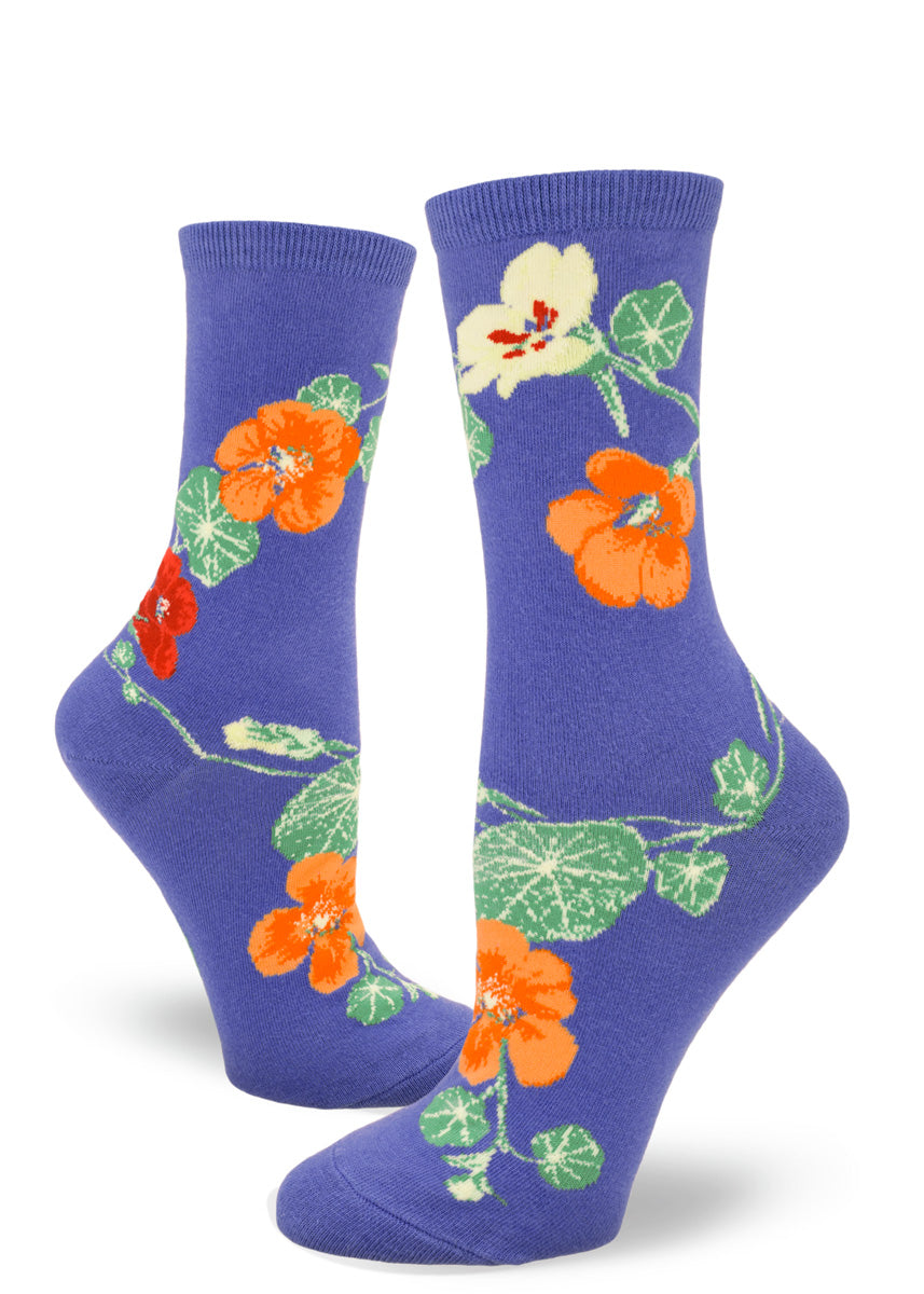 Crew socks for women with yellow, orange, and red nasturtium flowers on a periwinkle background.