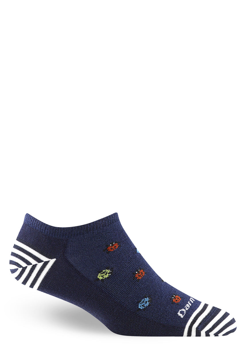 Navy low-cut wool ankle socks feature a pattern of multi-colored ladybugs and white stripes at the heel and toe. 