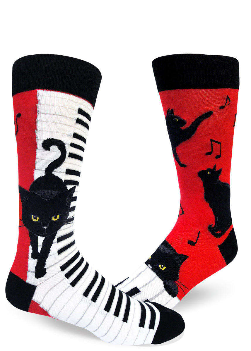 Funny piano cat socks for men with black cats playing pianos and music notes on a red background