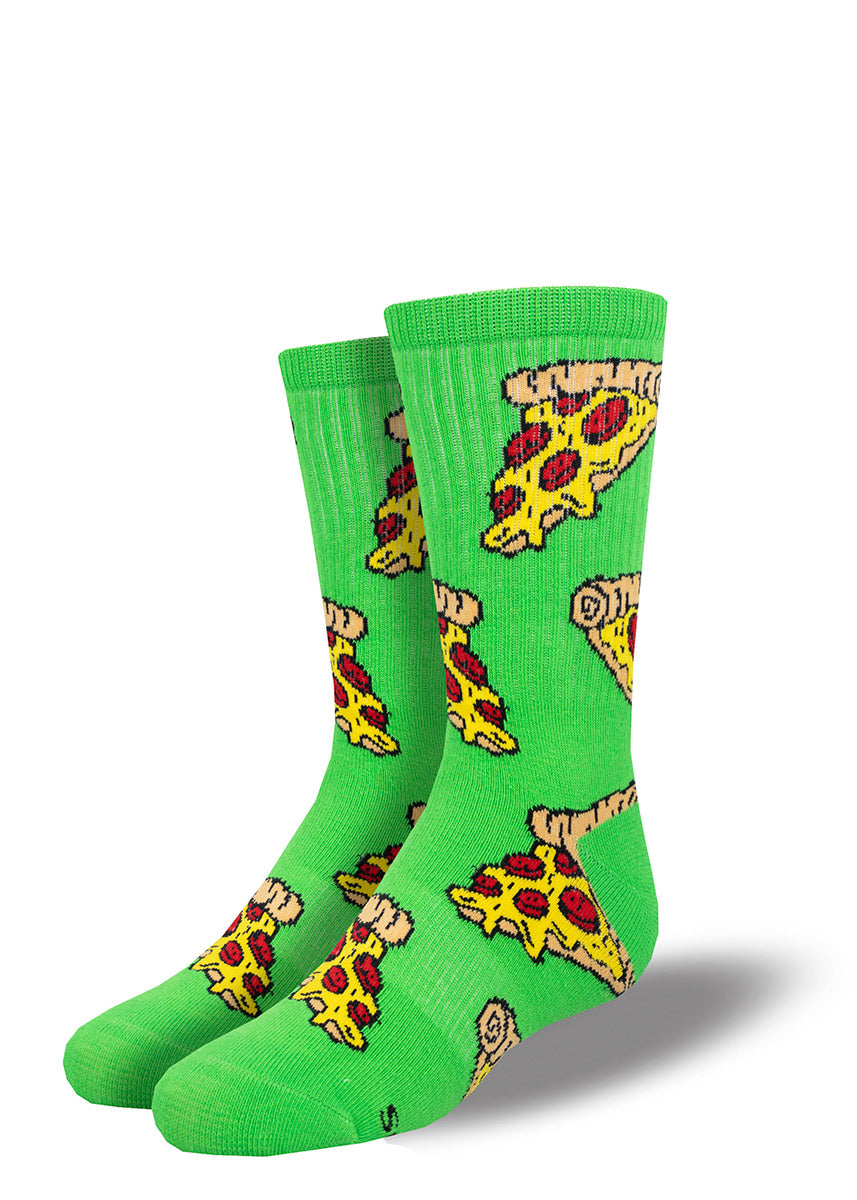 Athletic crew socks for kids have a pattern of pizza slices with oozing cheese and red pepperoni on a bold green background.