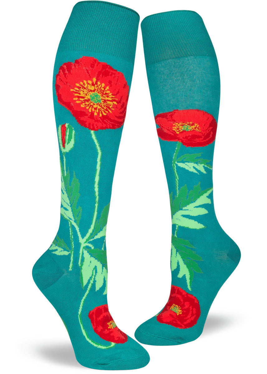 Knee-high poppy socks for women with red poppies on a teal background with an extra-stretchy cuff